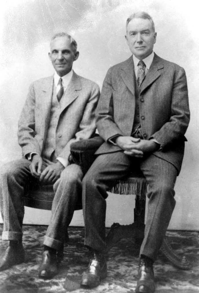 Portrait of Henry Ford and John D. Rockefeller, Jr., seated.